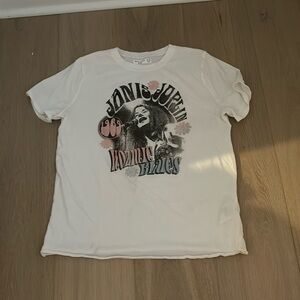 To is a white Abercrombie kids shirt.